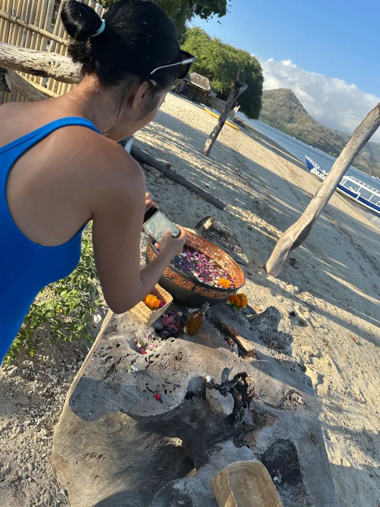 Dini photographing the flower bowl on the beach