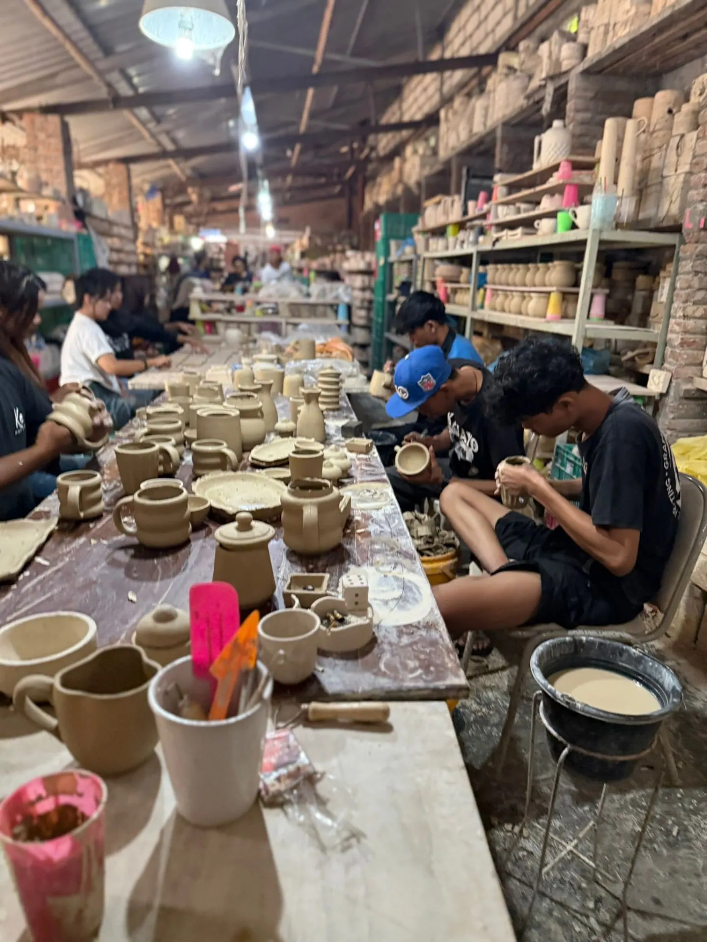 Artisans at work in a Yogyakarta ceramics workshop
