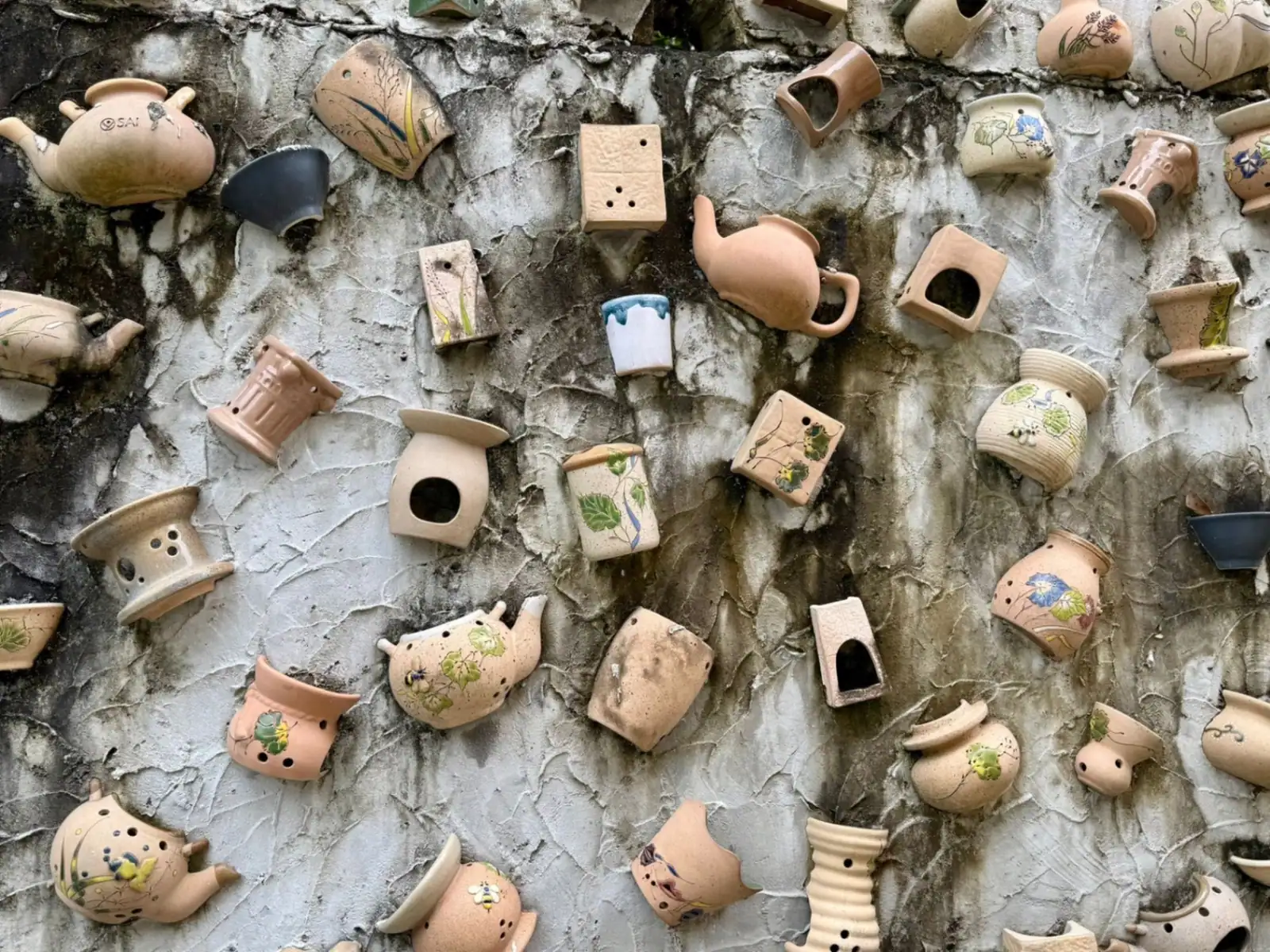 Wall of embedded ceramic pieces at the Yogyakarta workshop