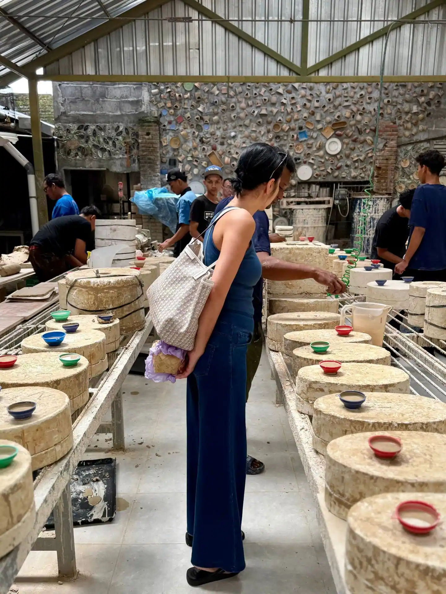 Visiting the ceramics workshop with moulds and colourful bowls